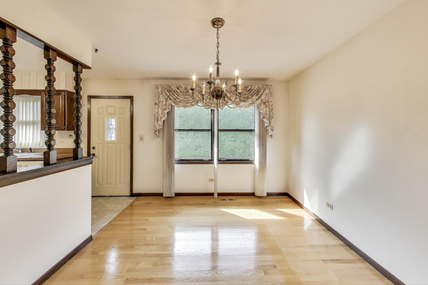 700 Noah Terrace Mount Prospect, IL 60056 - Photo 7 of 35 a view of a room with window and chandelier