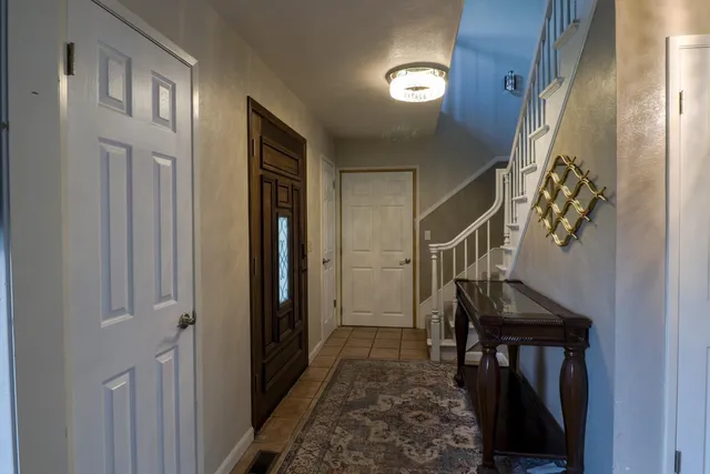 a view of entryway with a front door