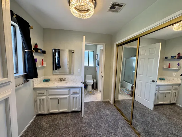 a room with lots of white furniture