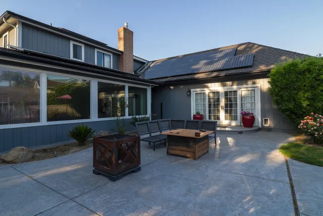 a view of a house with sitting area and furniture