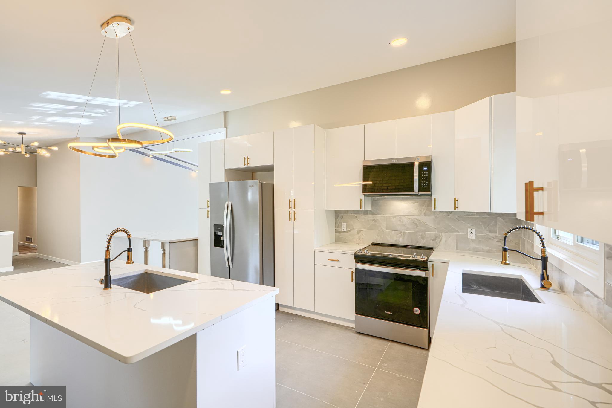 6200 Ivymount Road Baltimore, MD 21209 - Photo 17 of 71 a kitchen with a sink a stove and refrigerator