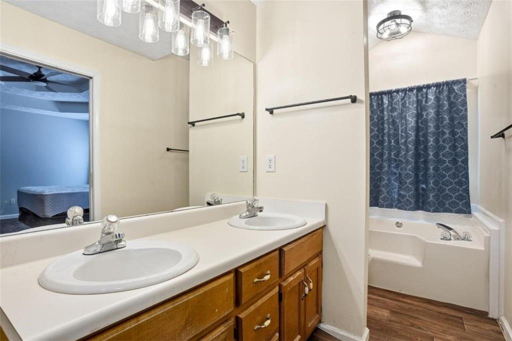 15 Beaverdam Lane Covington, GA 30016 - Photo 11 of 24 a bathroom with a sink and a mirror