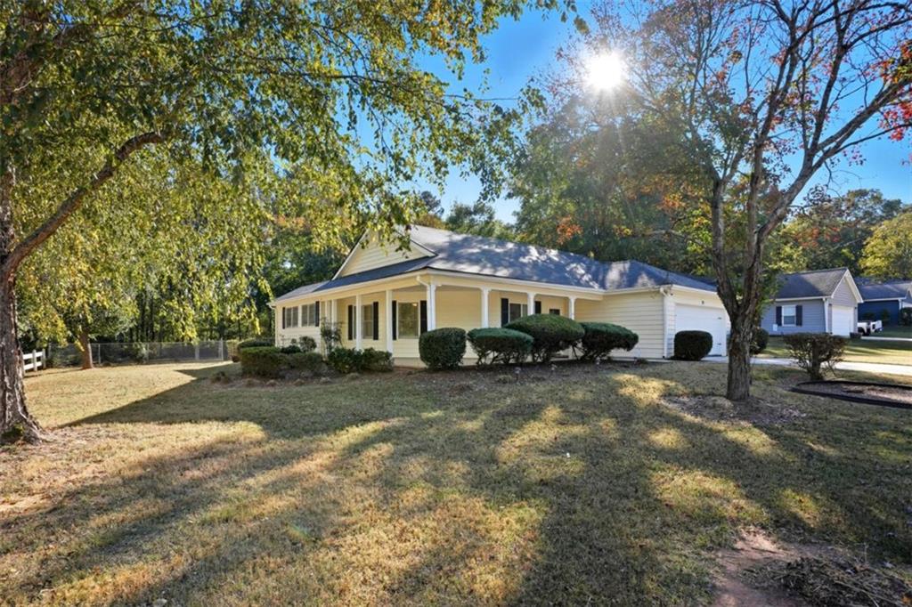 15 Beaverdam Lane Covington, GA 30016 - Photo 2 of 24 a front view of a house with a yard