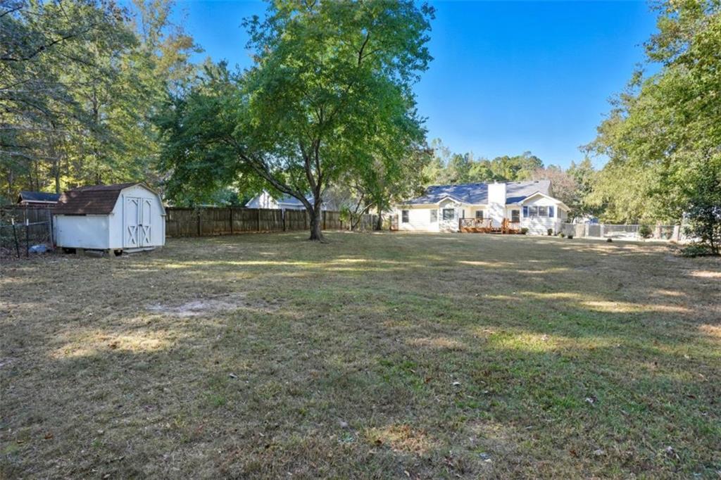 15 Beaverdam Lane Covington, GA 30016 - Photo 22 of 24 a view of a tree in front of a house