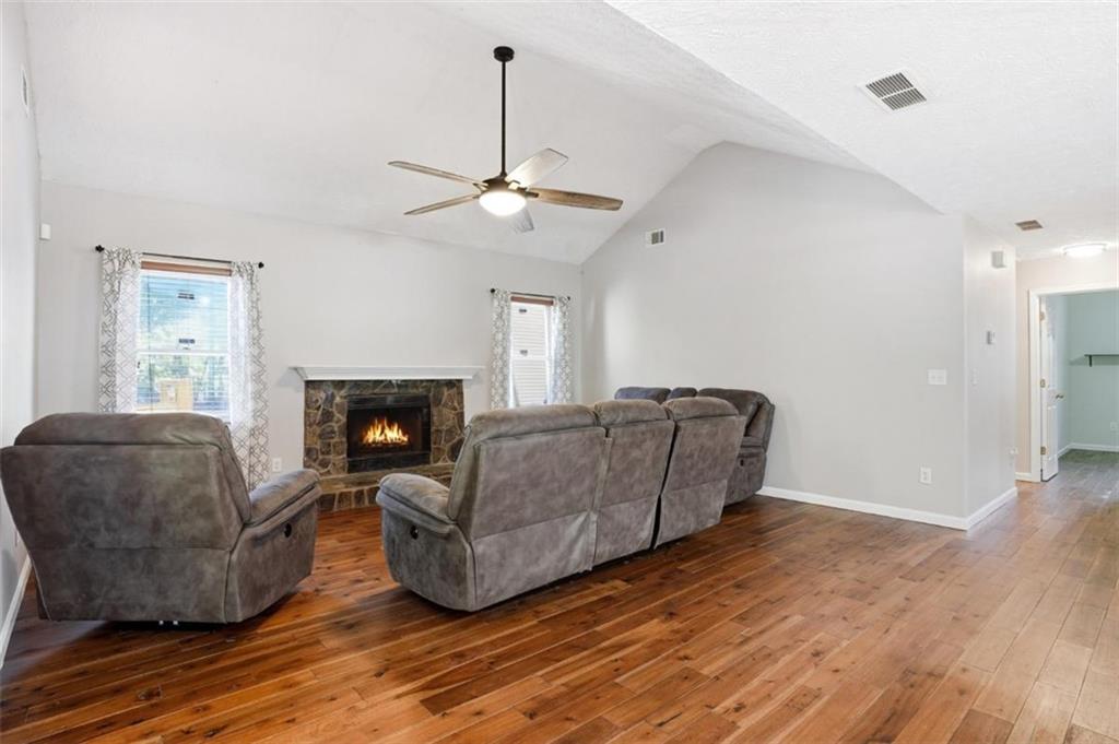 15 Beaverdam Lane Covington, GA 30016 - Photo 4 of 24 a living room with furniture and a fireplace