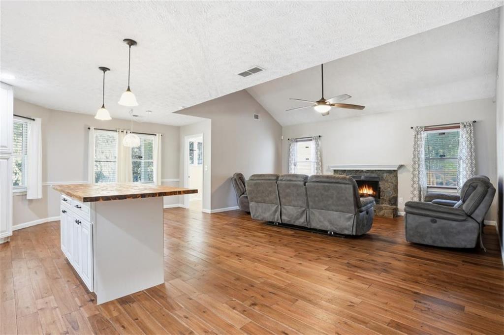 15 Beaverdam Lane Covington, GA 30016 - Photo 5 of 24 a living room with furniture and a fireplace