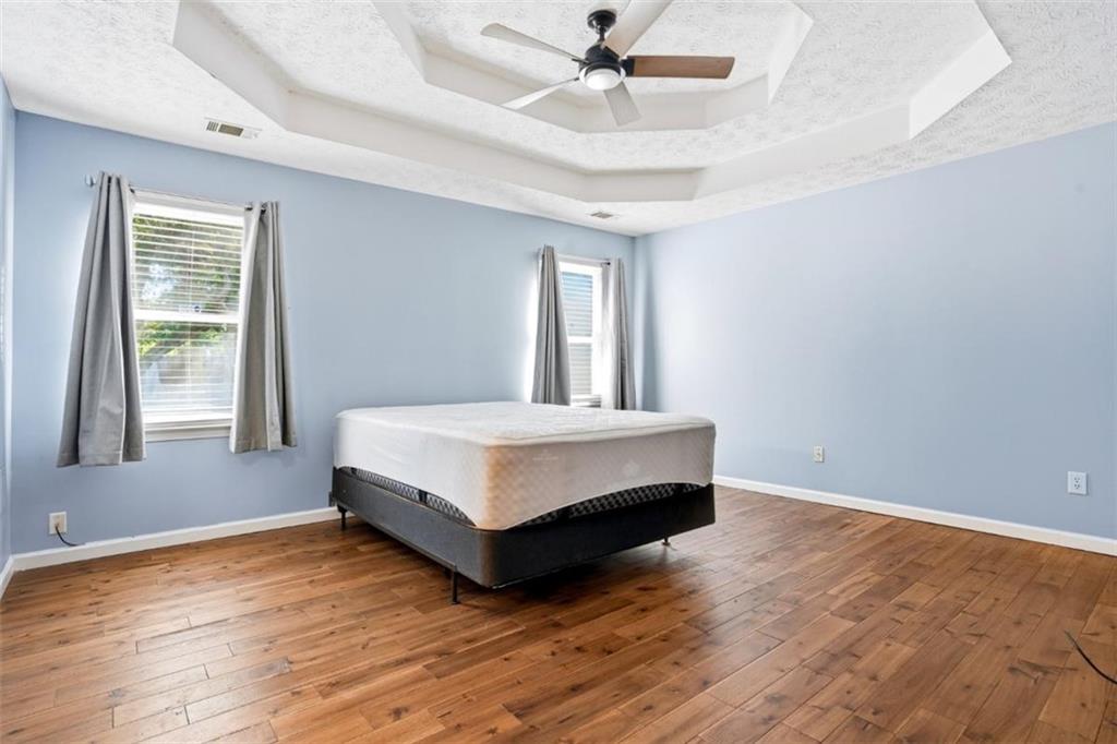 15 Beaverdam Lane Covington, GA 30016 - Photo 9 of 24 a spacious bedroom with a bed and window