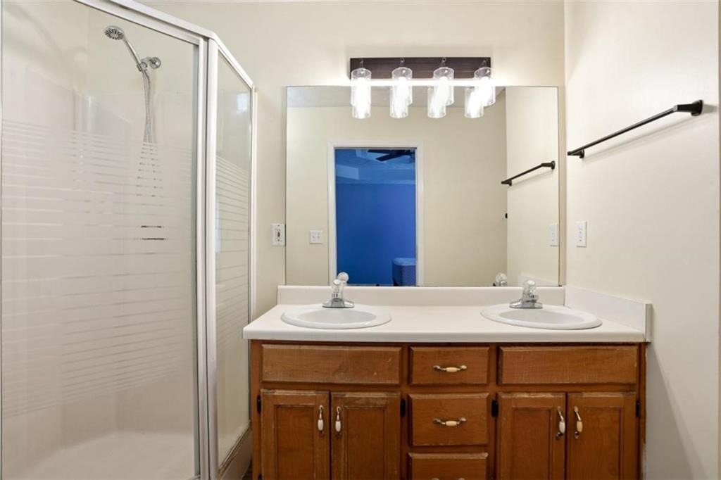 15 Beaverdam Lane Covington, GA 30016 - Photo 10 of 24 a bathroom with a sink vanity and a mirror
