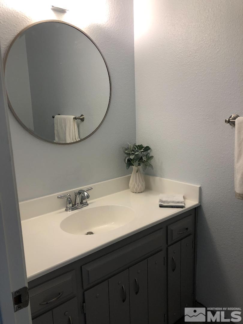 1305 Autumn Reno, NV 89511 - Photo 14 of 25 a bathroom with a sink and a mirror