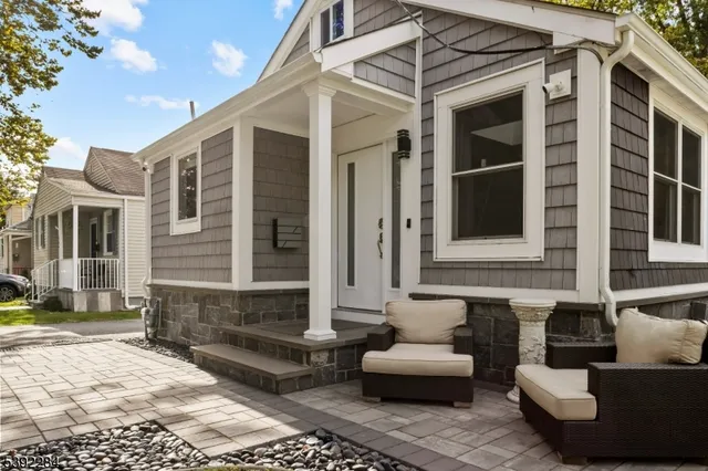 a view of a house with a couches and lounge chair