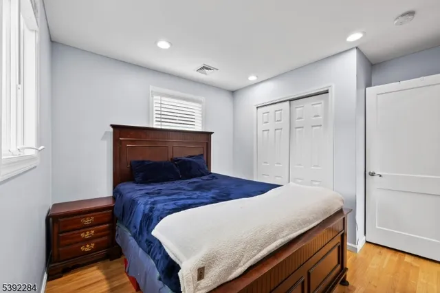 a bedroom with a bed and a dresser