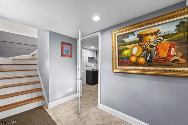 a view of an entryway with wooden floor