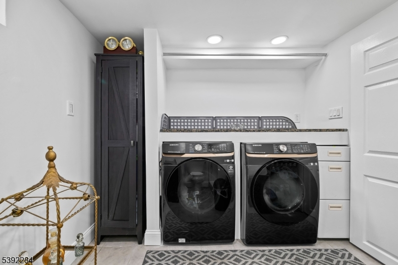 298 4th Avenue Hawthorne, NJ 07506 - Photo 23 of 26 a close view of utility and utility room with washer and dryer