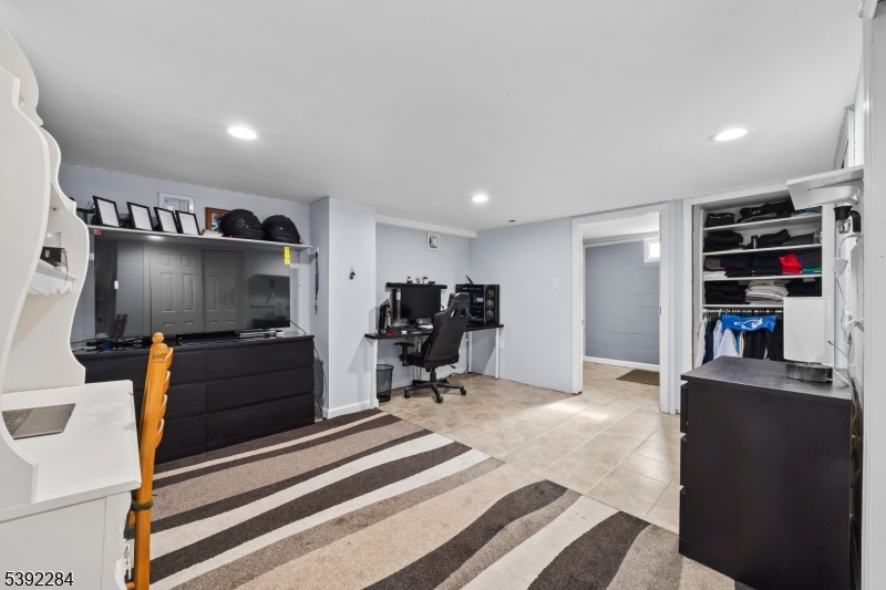 298 4th Avenue Hawthorne, NJ 07506 - Photo 26 of 26 a room with furniture and a flat screen tv