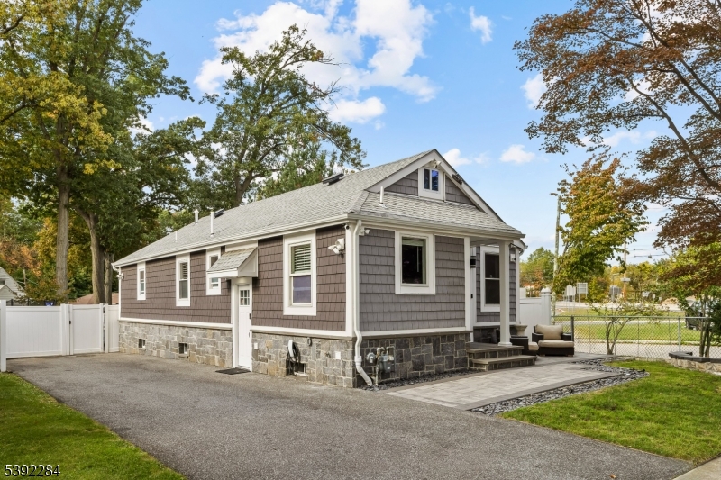298 4th Avenue Hawthorne, NJ 07506 - Photo 3 of 26 a front view of a house with a yard