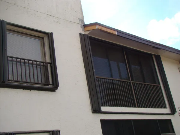 a kitchen with granite countertop white cabinets and stainless steel appliances