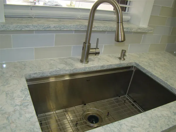 a view of a refrigerator in a kitchen