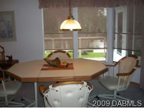 710 Navigators Way Edgewater, FL 32141 - Photo 3 of 7 a view of a dining room with furniture and a window