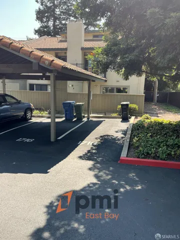 a view of a patio with table and chairs with wooden floor