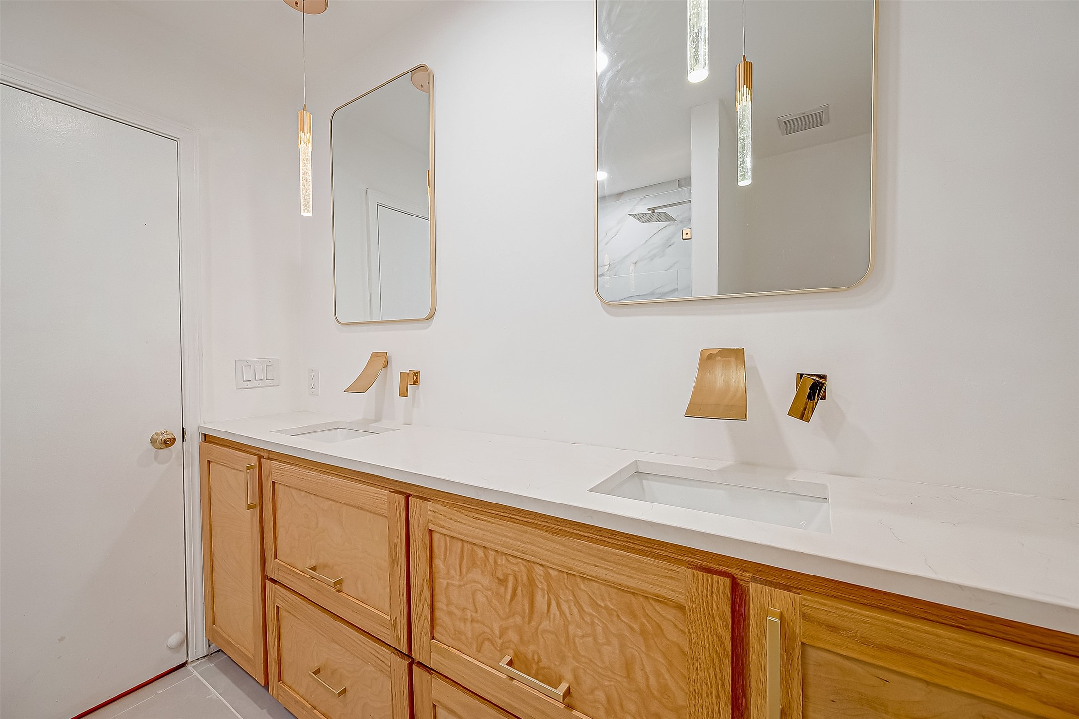 7497 Brompton Street, Unit 7497 Houston, TX 77025 - Photo 11 of 27 a bathroom with a sink and a mirror