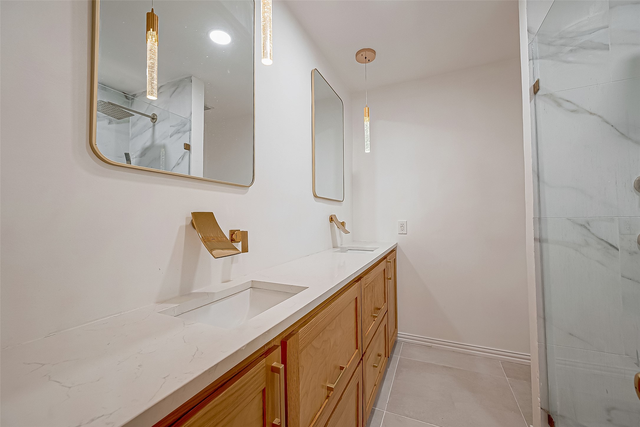 7497 Brompton Street, Unit 7497 Houston, TX 77025 - Photo 12 of 27 a bathroom with a sink and mirror
