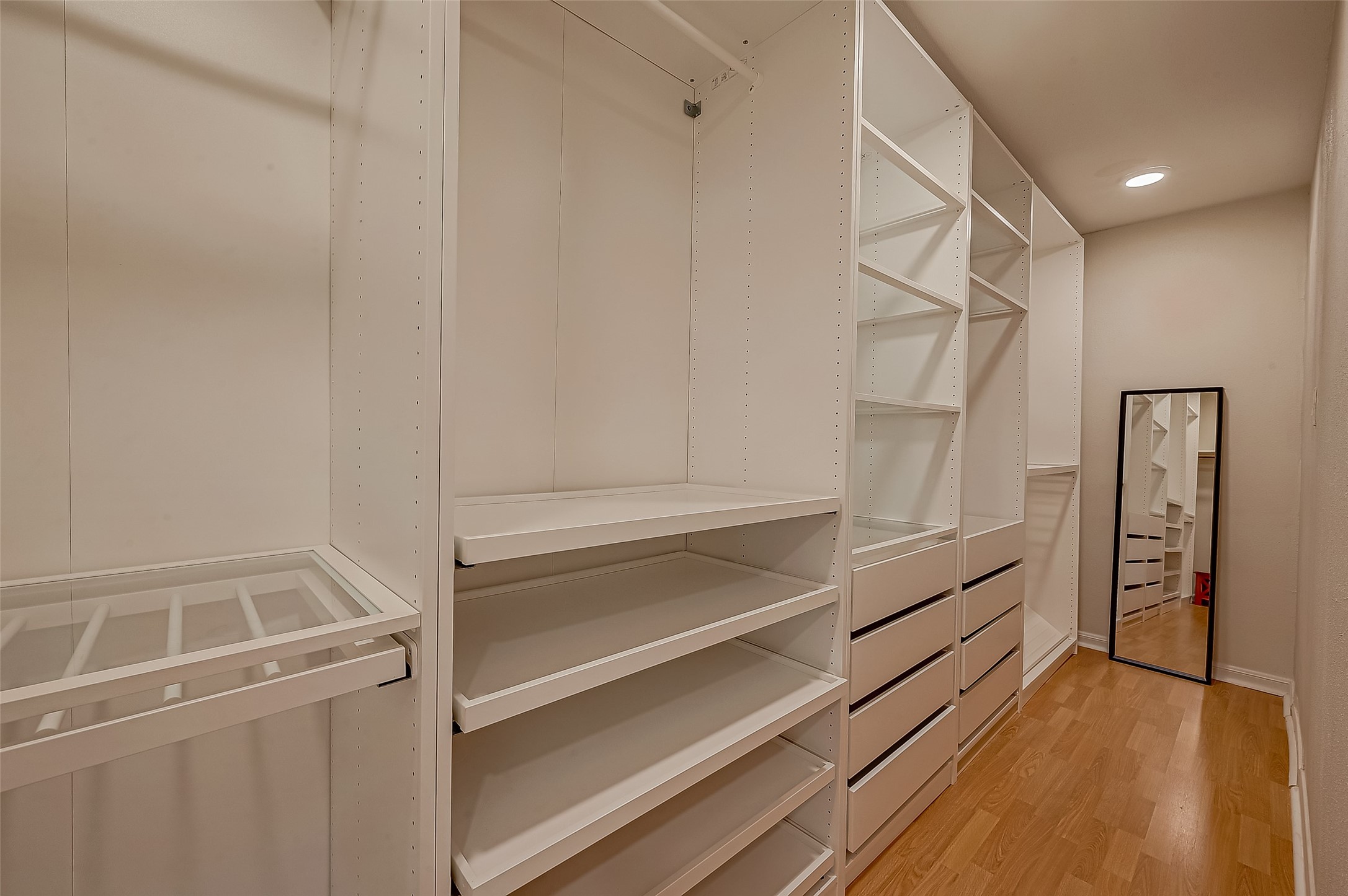 7497 Brompton Street, Unit 7497 Houston, TX 77025 - Photo 19 of 27 a view of walk in closet with empty racks