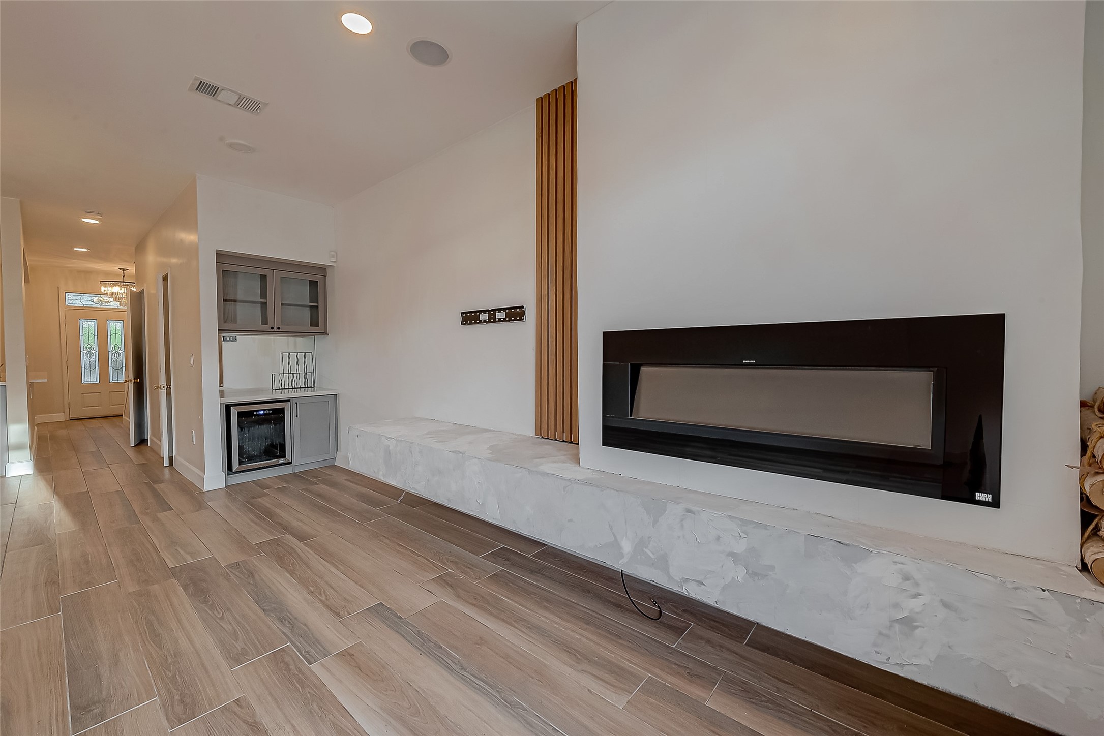 7497 Brompton Street, Unit 7497 Houston, TX 77025 - Photo 21 of 27 a living room with a fireplace and a couch