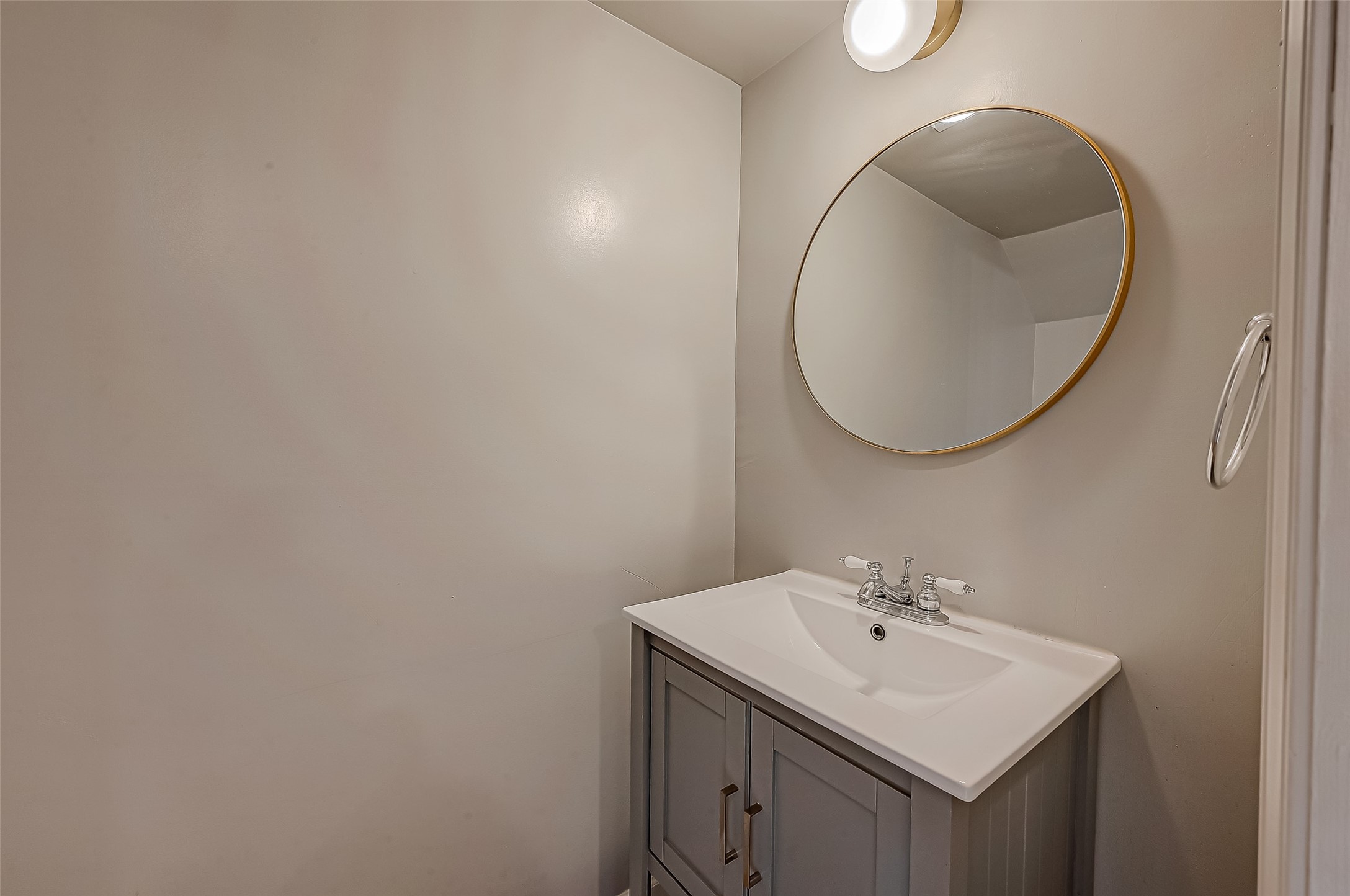 7497 Brompton Street, Unit 7497 Houston, TX 77025 - Photo 25 of 27 a bathroom with a sink and a mirror