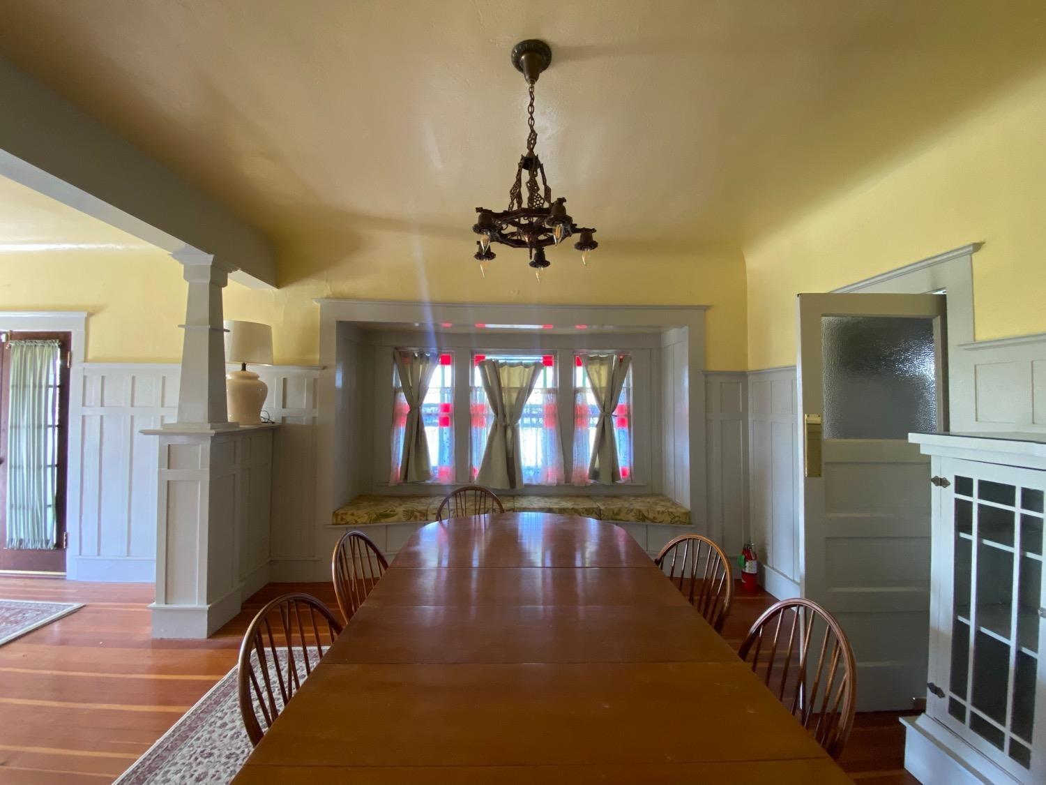 700 Wellsford Road Modesto, CA 95357 - Photo 11 of 47 a dining room with furniture a chandelier and window