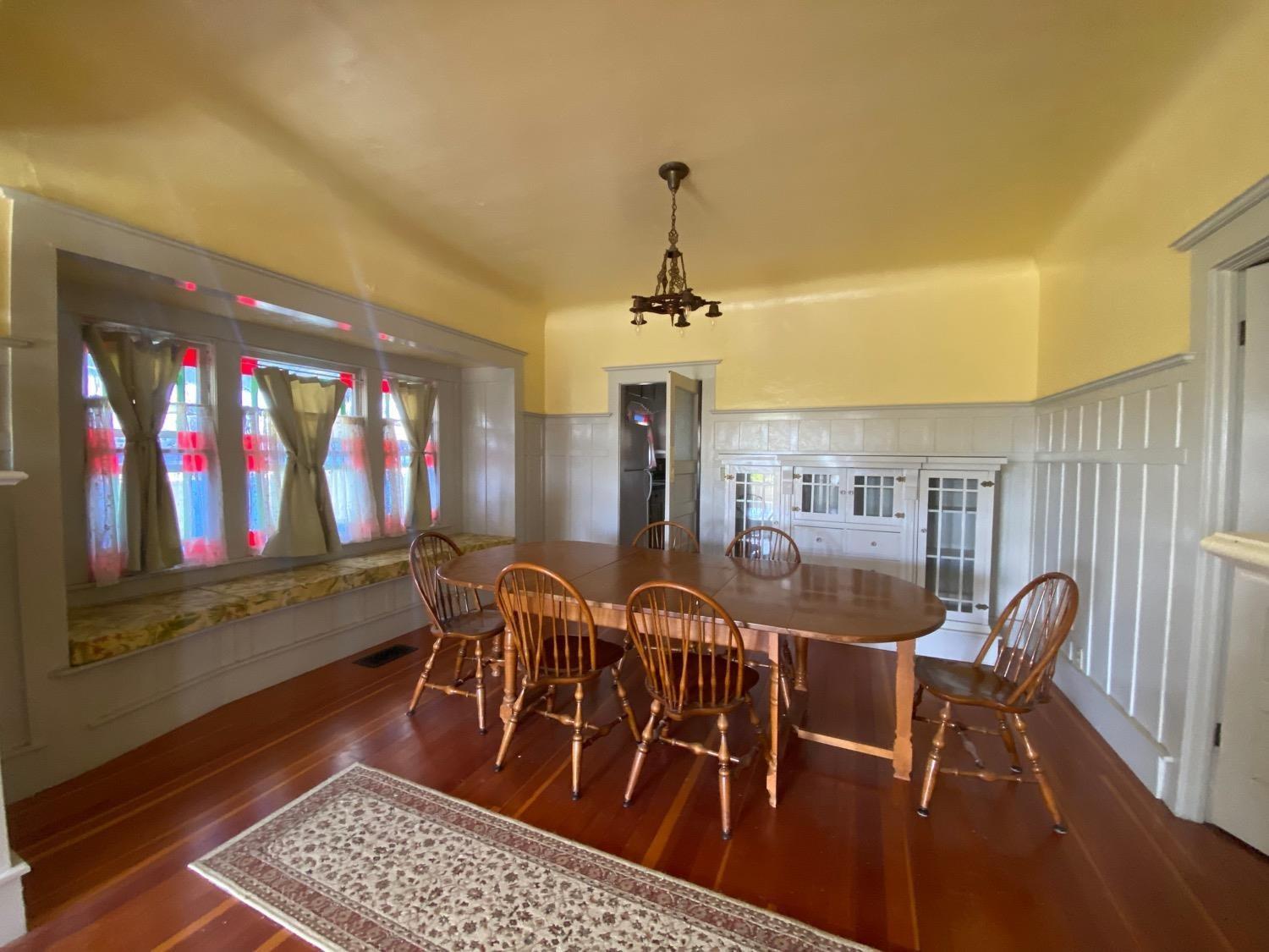 700 Wellsford Road Modesto, CA 95357 - Photo 12 of 47 a view of a dining room with furniture and chandelier