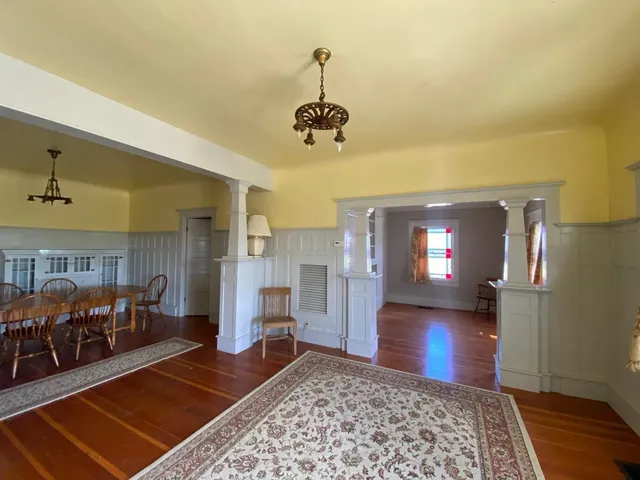 a view of a living room and dining room