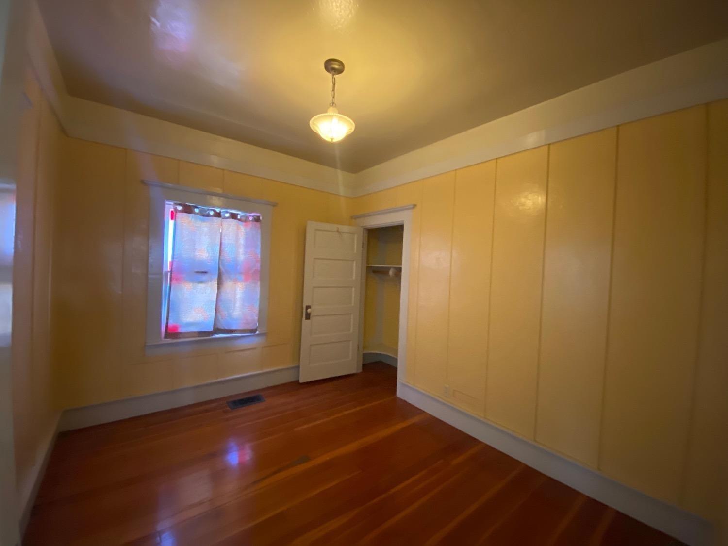 700 Wellsford Road Modesto, CA 95357 - Photo 20 of 47 a view of an empty room with window and chandelier fan