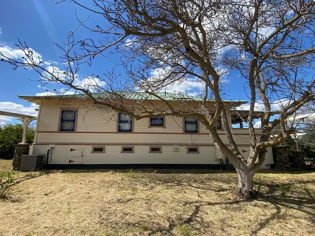 a white house covered with snow in it