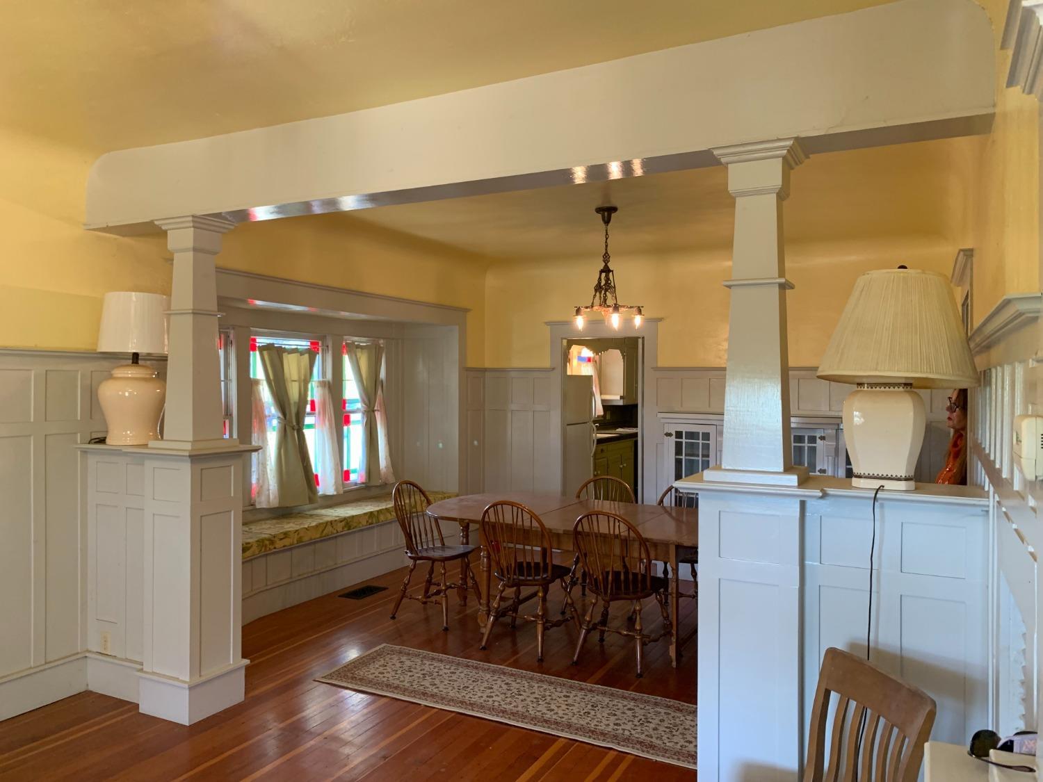 700 Wellsford Road Modesto, CA 95357 - Photo 29 of 47 a view of a dining room and livingroom with furniture wooden floor a chandelier
