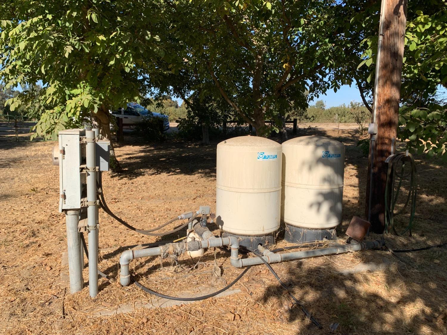 700 Wellsford Road Modesto, CA 95357 - Photo 45 of 47 a backyard of a house with table and chairs