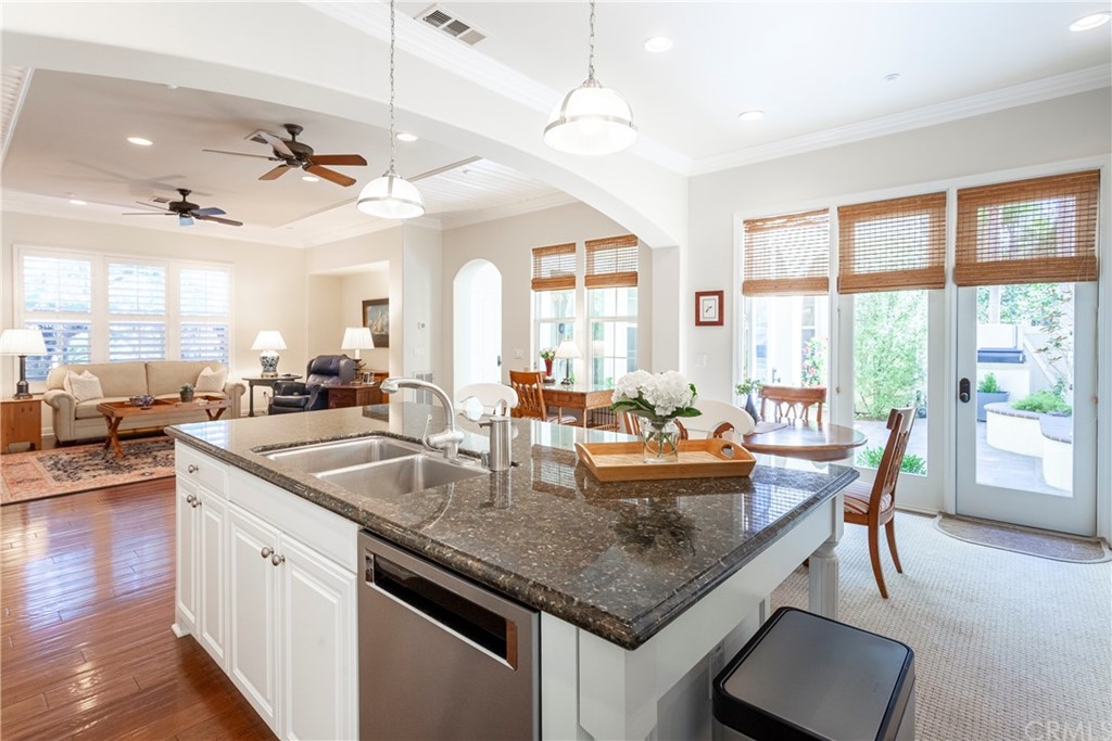 21246 Baeza Circle Huntington Beach, CA 92648 - Photo 15 of 49 a dining table with chairs and view of kitchen