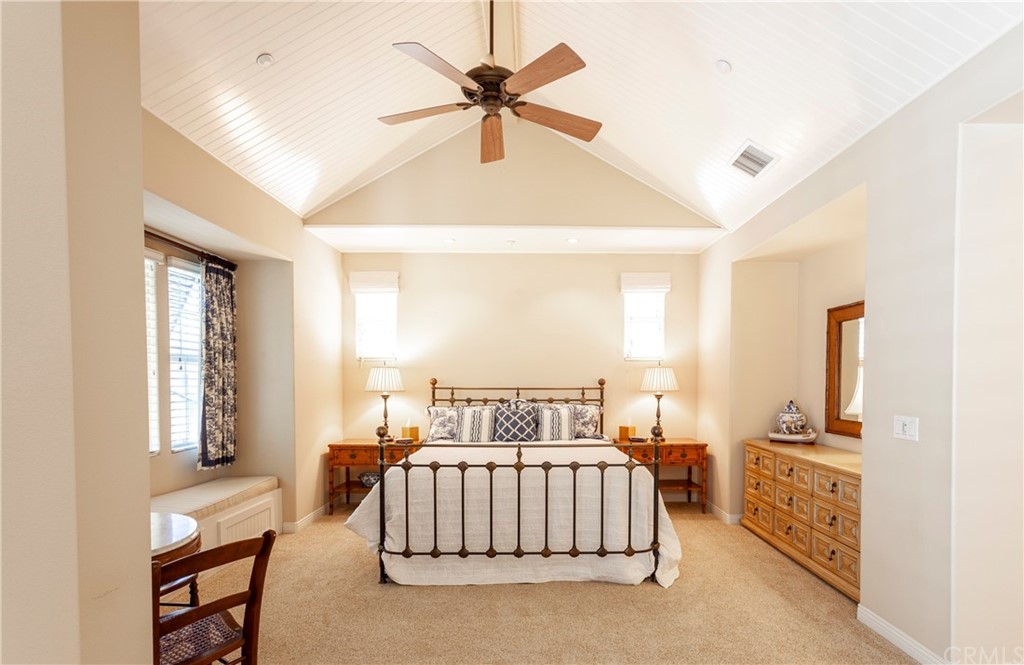 21246 Baeza Circle Huntington Beach, CA 92648 - Photo 20 of 49 a bedroom with a bed and a chandelier