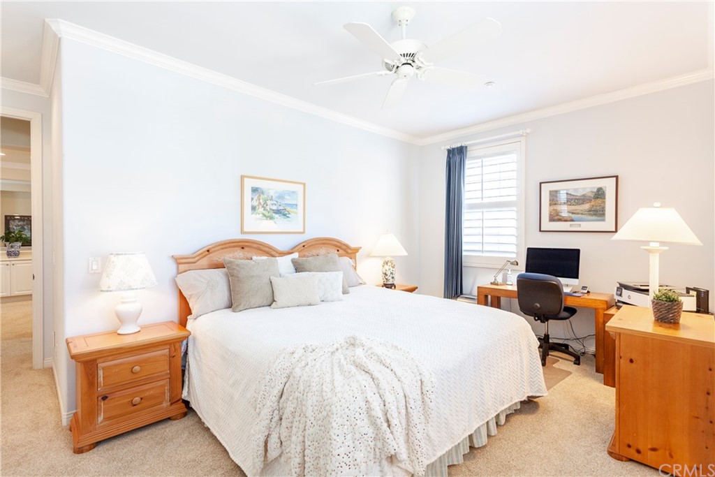 21246 Baeza Circle Huntington Beach, CA 92648 - Photo 31 of 49 a bedroom with bed a table and chair