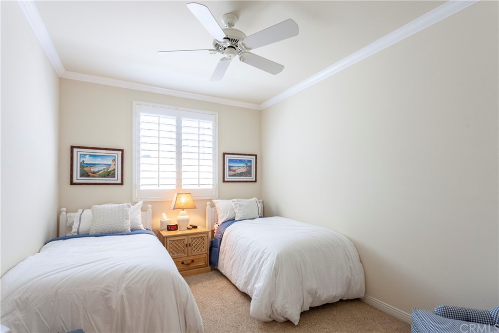 21246 Baeza Circle Huntington Beach, CA 92648 - Photo 34 of 49 a bedroom with two beds and a window
