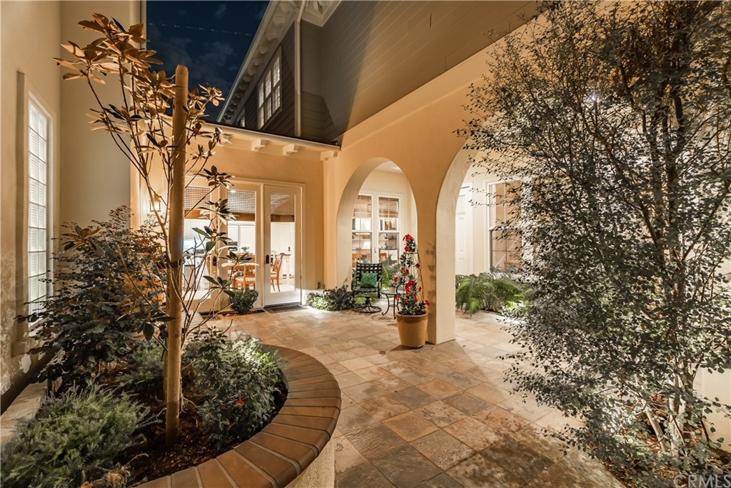 21246 Baeza Circle Huntington Beach, CA 92648 - Photo 39 of 49 a view of a large building with large trees and plants