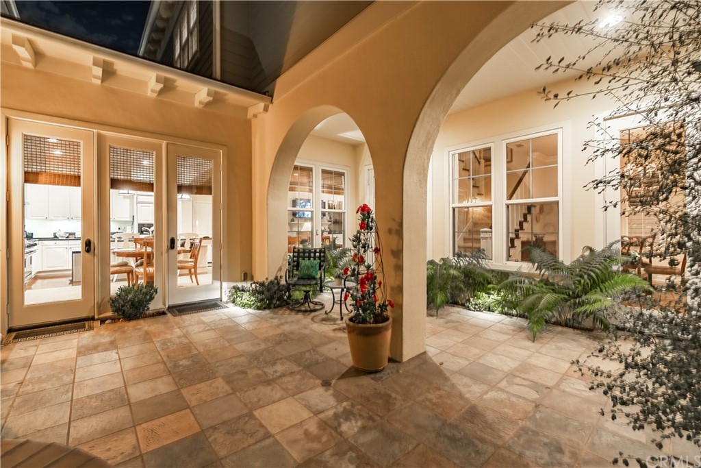 21246 Baeza Circle Huntington Beach, CA 92648 - Photo 46 of 49 a view of an entryway with flower plants