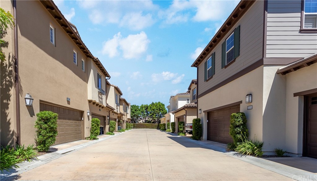 21246 Baeza Circle Huntington Beach, CA 92648 - Photo 48 of 49 a street view with tall buildings