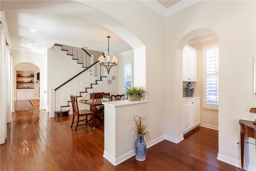 21246 Baeza Circle Huntington Beach, CA 92648 - Photo 7 of 49 a view of entryway and dining room with wooden floor