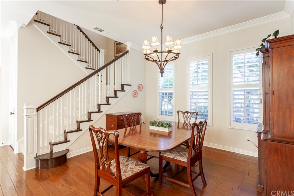 21246 Baeza Circle Huntington Beach, CA 92648 - Photo 9 of 49 a view of a dining room with furniture window and wooden floor