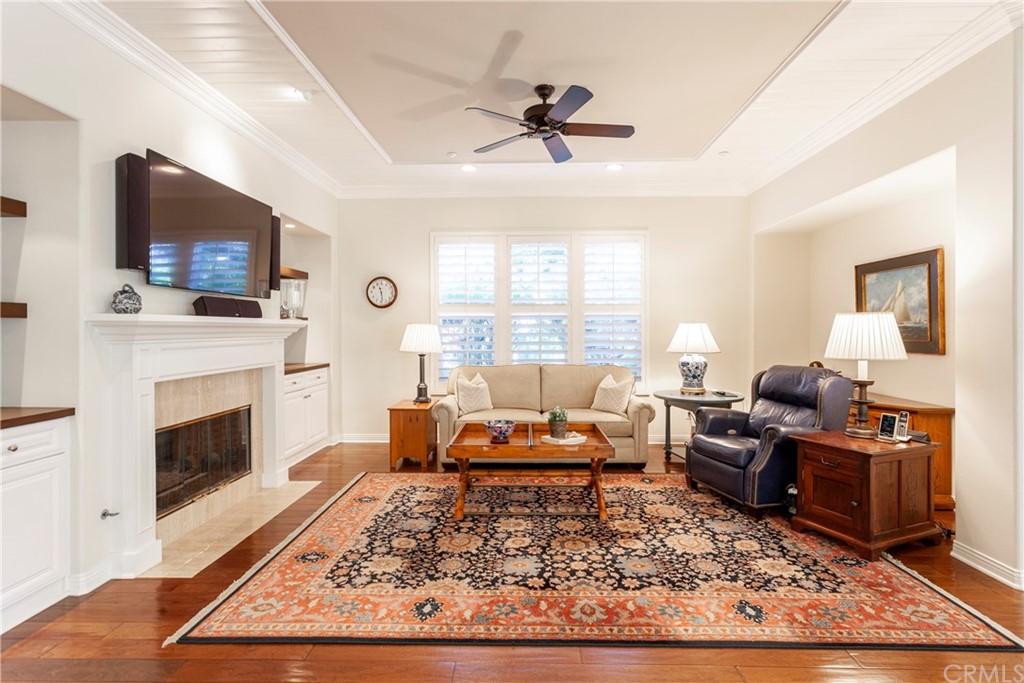 21246 Baeza Circle Huntington Beach, CA 92648 - Photo 10 of 49 a living room with furniture a rug and a fireplace