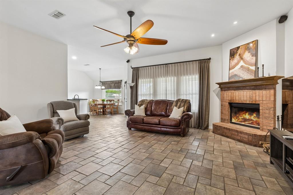 1901 Saw Tooth Court Haslet, TX 76052 - Photo 12 of 38 a living room with furniture and a fireplace