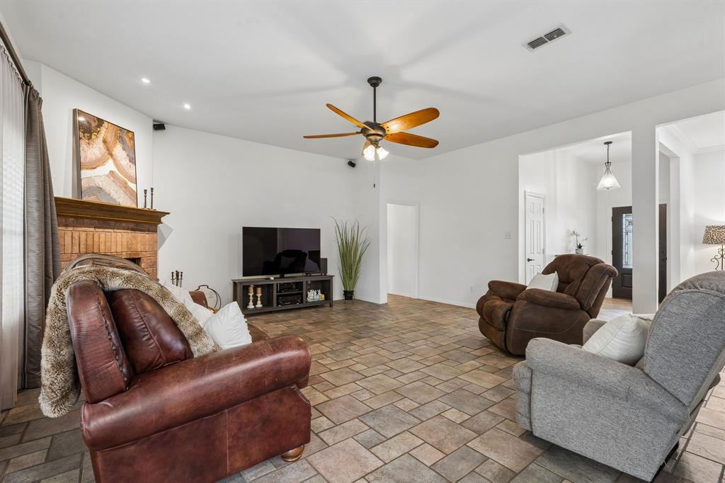1901 Saw Tooth Court Haslet, TX 76052 - Photo 14 of 38 a living room with furniture and a flat screen tv