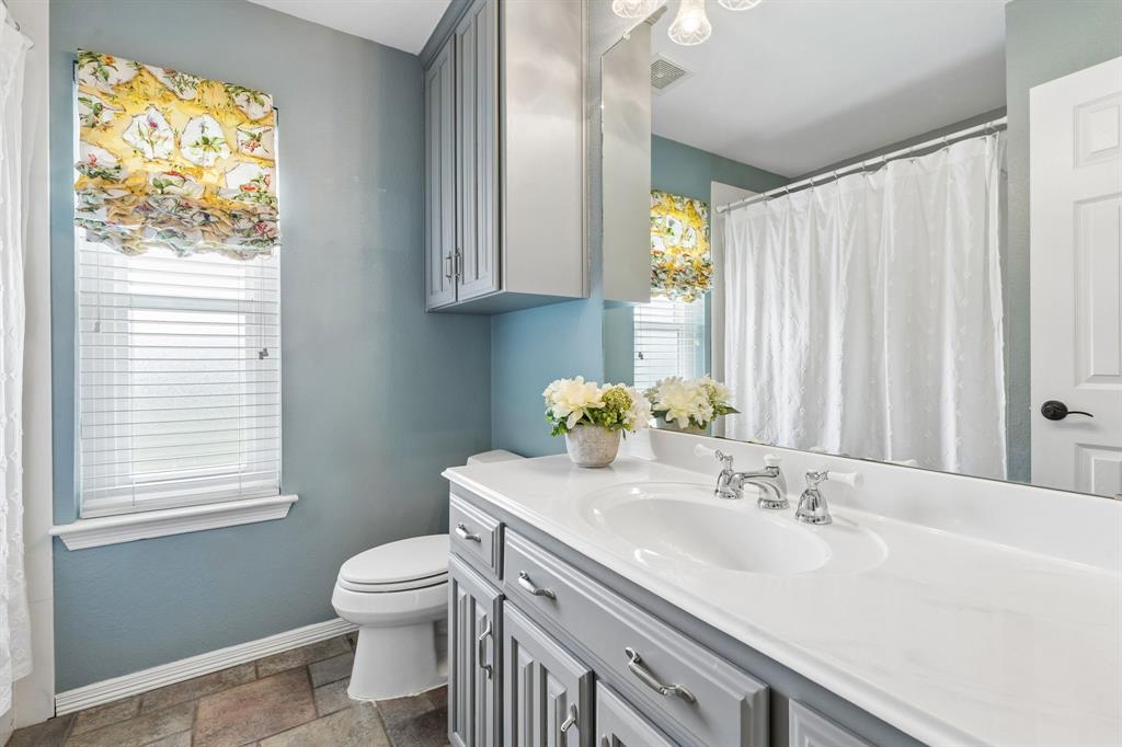 1901 Saw Tooth Court Haslet, TX 76052 - Photo 23 of 38 a bathroom with a sink toilet and window