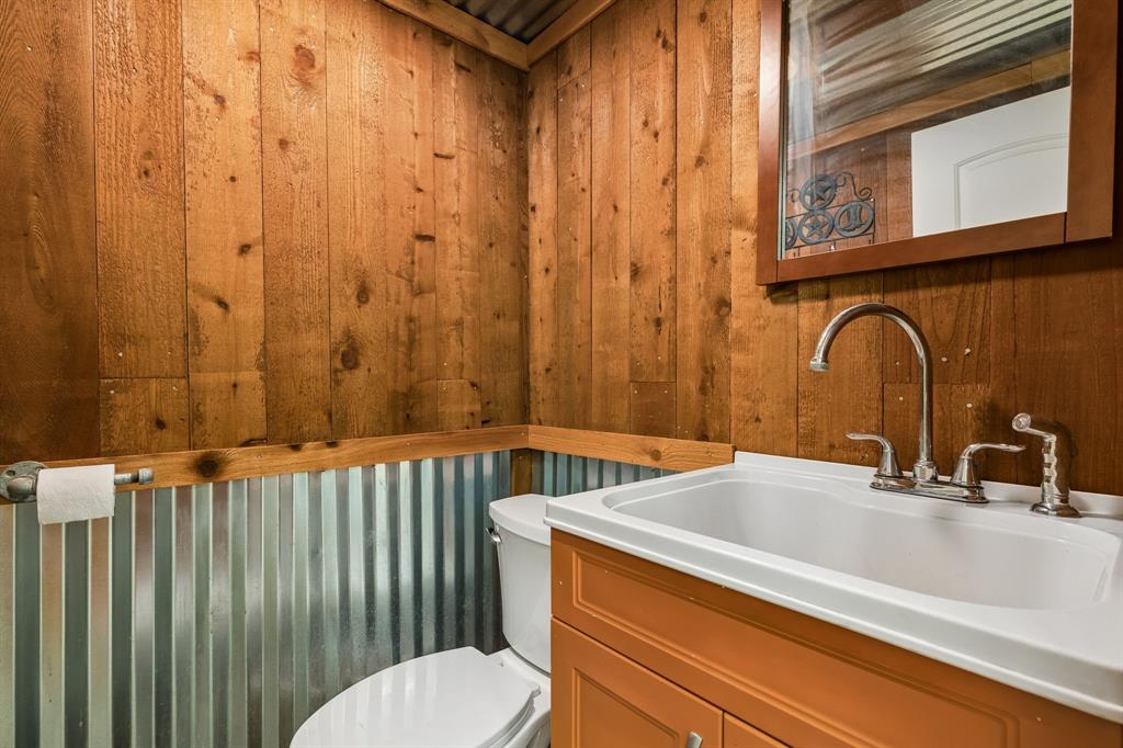 1901 Saw Tooth Court Haslet, TX 76052 - Photo 27 of 38 a bathroom with a sink and a toilet