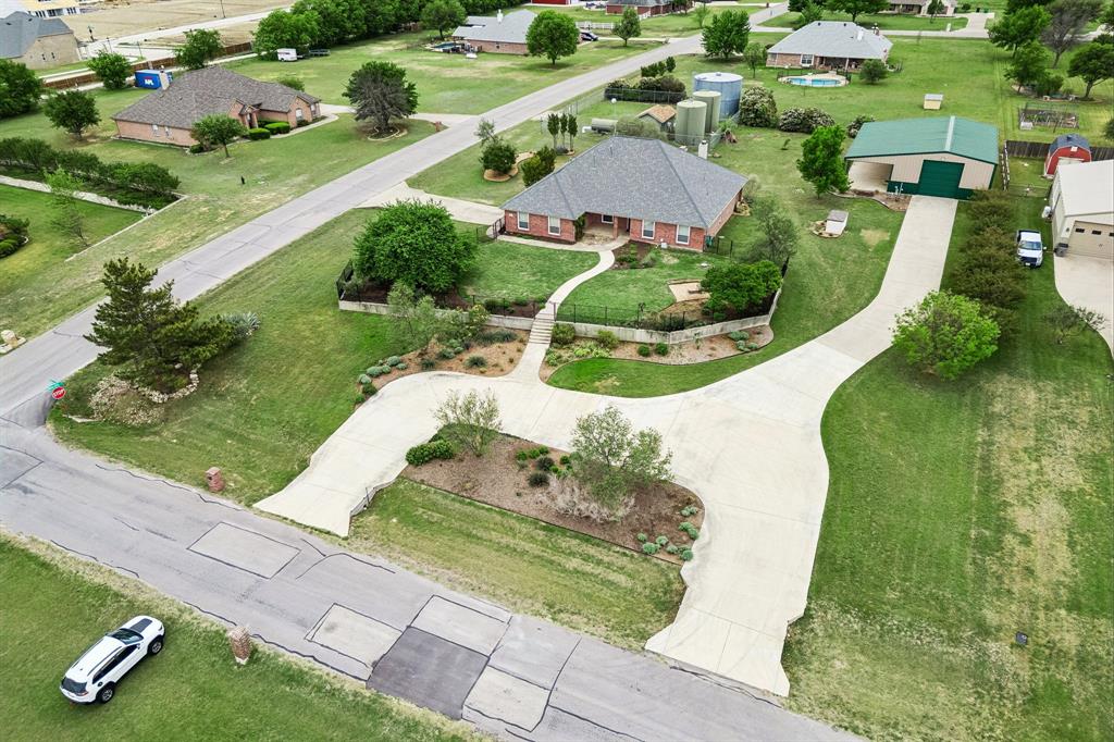 1901 Saw Tooth Court Haslet, TX 76052 - Photo 30 of 38 an aerial view of a house with a garden and swimming pool